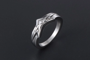 Macro side view of silver star titanium steel ring with geometric jagged punk design