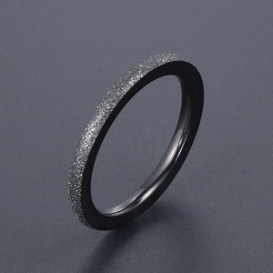 Minimalist black titanium steel ring featuring a frosted starry surface and polished interior