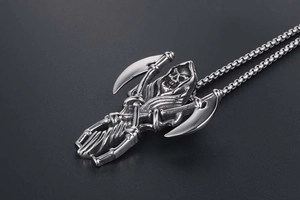Macro shot of Gothic Grim Reaper pendant with dual scythes and detailed bone structure