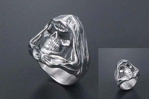 Detailed close-up of hooded skull ring in vintage silver punk stainless steel