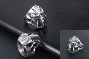 Detailed view of the intricate bone texture and punk style of this men's steel monster ring