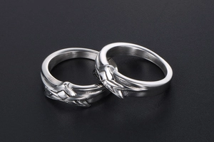 Macro view of silver star rings with geometric relief texture and industrial punk style