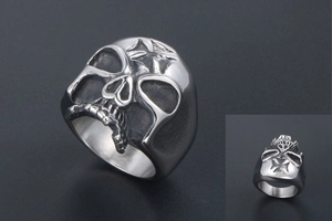 Detailed view of silver skull ring featuring vintage cross engraving and matte finish
