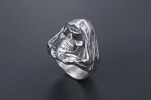 Close-up of gothic grim reaper skull ring with vintage silver finish and polished details