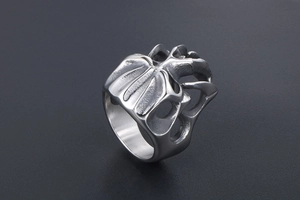 Macro shot of gothic titanium steel monster ring with anatomical heart texture detail