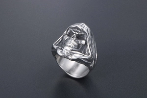 Detailed close-up of gothic grim reaper skull ring with vintage distressed steel finish
