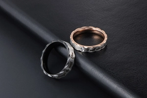 Detail of couple rings with diamond inlay and I will always be with You engraving