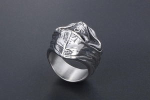 Macro detail of gothic grim reaper skull ring made of polished silver steel