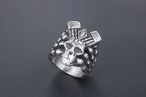 Detailed view of punk style stainless steel skull ring with crown mechanical design