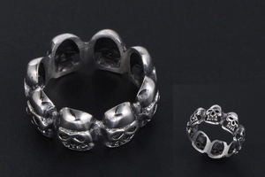 Macro detail of retro skull ring band with blackened punk finish and gothic relief