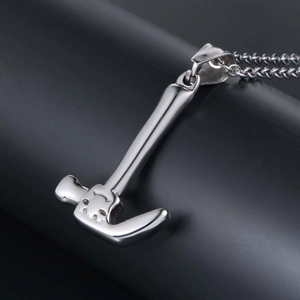 Polished silver hammer pendant necklace in stainless steel with a minimal industrial style