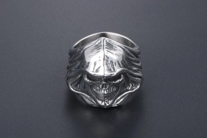 Detailed close-up of gothic grim reaper skull ring in silver stainless steel