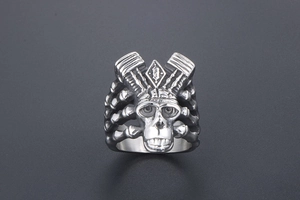 Top view of punk skull engine ring featuring industrial mechanical piston details