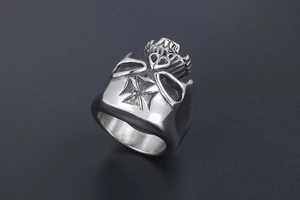 Macro shot of gothic titanium steel ring featuring skull relief and Iron Cross details