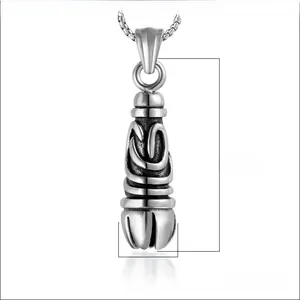 Macro detail of gothic stainless steel pendant showing engraved textures and dimensions