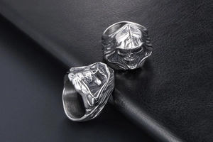 Detailed view of punk reaper skull rings in antique silver finish for men