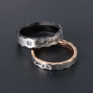 Polished silver titanium couple rings with letter engraving and micro-inlaid zircon stones