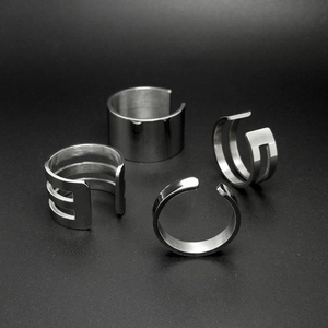 Minimalist silver steel ring set featuring hollow bands and smooth wide adjustable rings