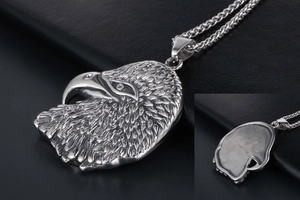 Detailed close-up of eagle head pendant showing textured feathers and steel finish