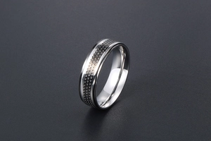 Macro detail of silver titanium steel ring with dark honeycomb texture pattern