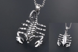 Macro view of a realistic stainless steel scorpion pendant with detailed anatomical textures