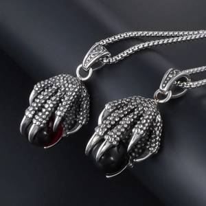 Gothic dragon claw pendant necklace in stainless steel with red and black crystal orb