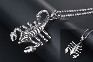 Detailed view of scorpion pendant showing intricate body segments and stainless steel texture