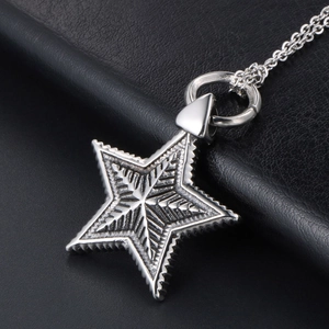 Vintage gothic star pendant necklace in silver stainless steel on black leather background