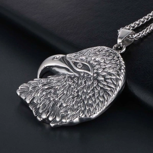 Rugged eagle head pendant necklace in silver stainless steel from a 45-degree angle