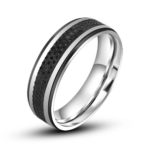 Minimalist silver steel ring with black honeycomb texture center and polished edges