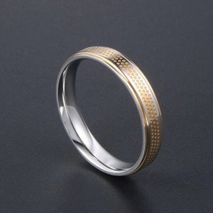 Minimalist silver steel ring with gold dotted relief and polished inner band for couples