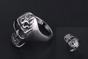 Detailed view of punk flame skull ring showing gothic patterns and vintage silver finish