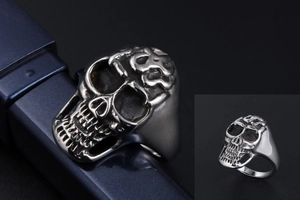 Detailed macro view of silver titanium steel skull ring with vintage distressed finish