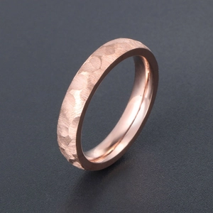 Rose gold titanium steel ring with unique hammered texture and polished inner surface