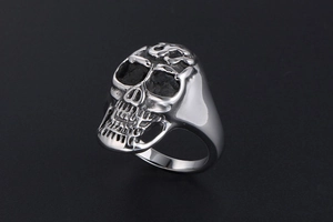 Detailed macro view of a vintage silver skull ring made of durable titanium steel