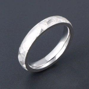 Minimalist silver titanium steel ring with hammered texture and polished inner band
