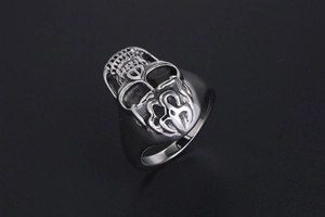 Close-up of vintage gothic skull ring in polished silver finish with antique details