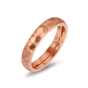 Minimalist rose gold titanium ring featuring a unique hammered texture finish for couples