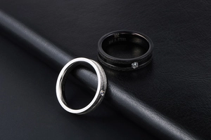 Macro shot of matte finish titanium steel rings with 316 stainless steel engraving