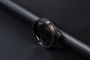 Macro view of matte black 316 stainless steel ring featuring a sparkling zircon stone