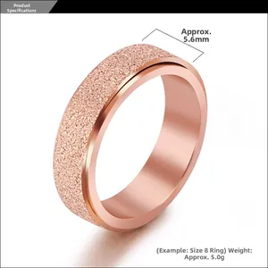 Detail of 5.6mm rose gold rotatable ring featuring frosted finish and polished edges