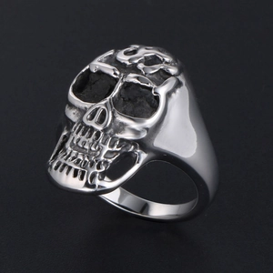 Classic silver titanium steel skull ring with vintage flame patterns and punk aesthetic