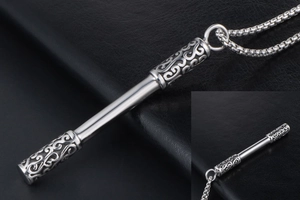 Detailed view of Ruyi Jingu Bang pendant with intricate auspicious cloud relief patterns