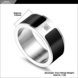 Macro detail of 9mm wide titanium steel ring with black enamel and center zircon stone