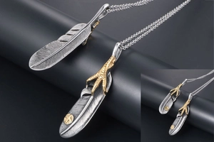 Detailed macro view of vintage feather pendants with intricate golden eagle claw textures
