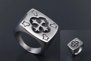 Macro shot of vintage titanium steel square ring featuring hollow cross relief and stars