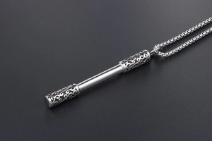 Detailed close-up of Ruyi Jingu Bang staff pendant with retro cloud patterns and square pearl chain