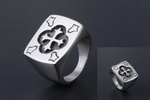 Macro shot of titanium steel signet ring featuring a vintage engraved cross pattern