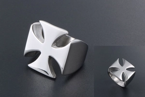 Detailed macro shot of silver iron cross ring featuring a high-polished metallic finish