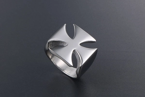 Detail of silver stainless steel ring featuring a cutout Maltese cross design
